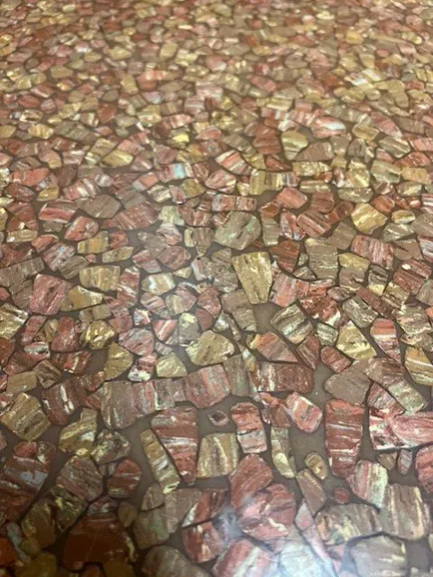 Close-up of the original 1969 stone chip pattern vinyl floor still in place at Santa Maria City Hall