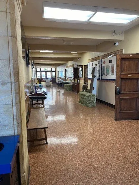 The long central hallway of Santa Maria City Hall showing the original vinyl flooring stretching the full length of the corridor
