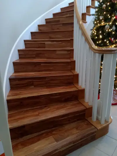 Completed flooring installation: Hardwood staircase