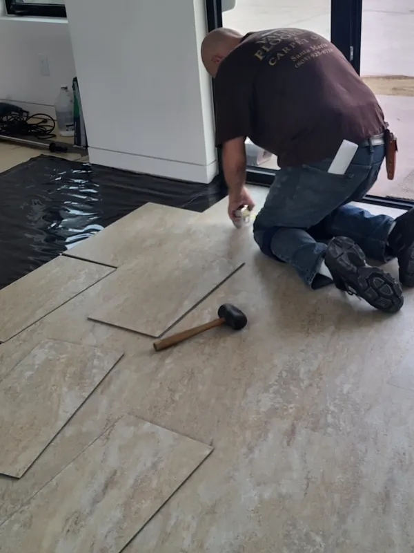 Valley Flooring installer measuring and fitting flooring on site