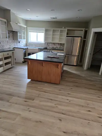 Completed flooring installation: Kitchen new wood flooring