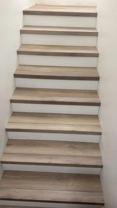 Completed flooring installation: LVP staircase