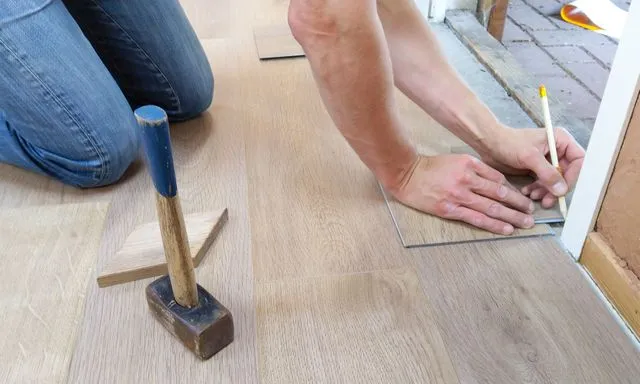 Valley Flooring craftsman performing a precise flooring installation