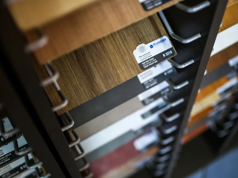 Warm tabac laminate flooring boards with realistic wood-look finish