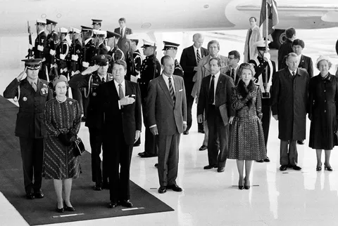 Queen Elizabeth II and President Ronald Reagan standing on a red carpet provided by Valley Flooring